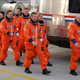 NASA Space Shuttle astronauts wearing their iconic orange suits while preparing for the STS-124 mission in 2008.